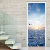 Vinyle et autocollants portes coucher de soleil dans la mer